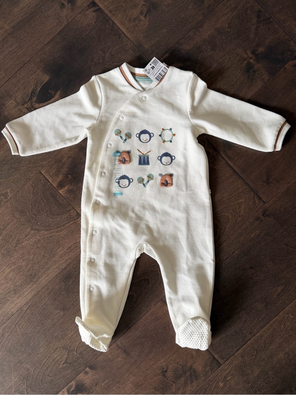 Cream Footed Baby One-Piece with Playful Musical Animals